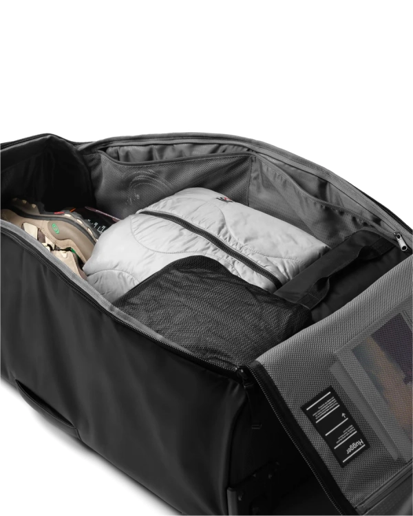 Torba podróżna na kółkach DB Hugger Roller 90L 2.png.webp